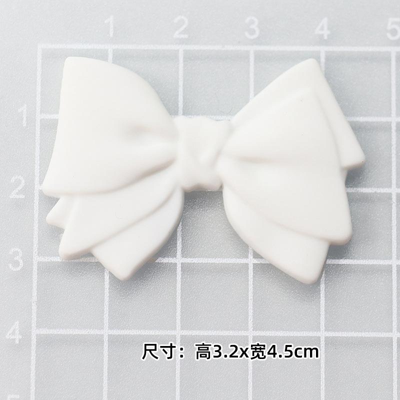 Soft glue: white bow "3.2*4.5cm]
