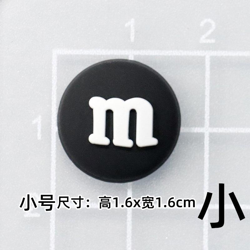 Soft glue: small black M beans [1.5*1.5cm]]