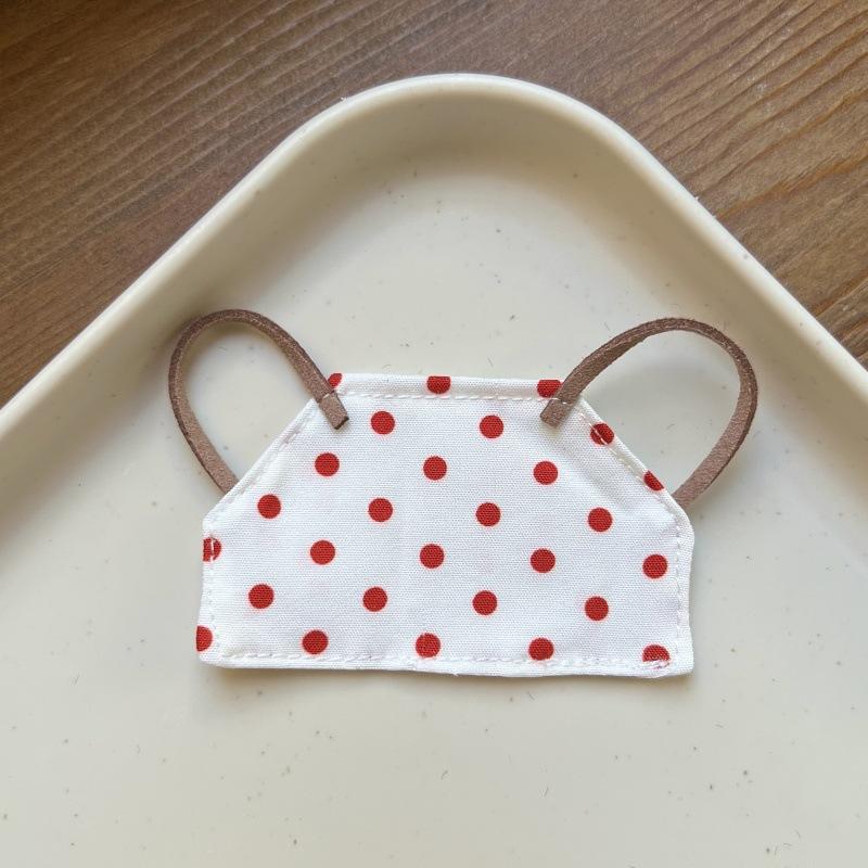 White apron with red dots