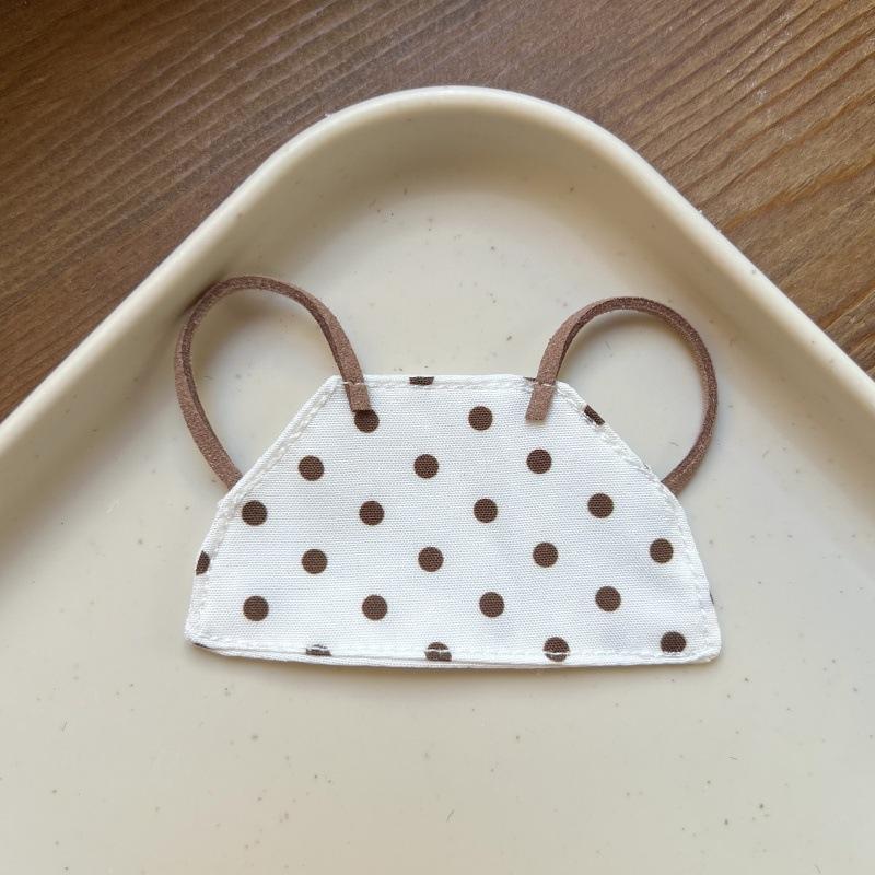Brown dot apron on white background